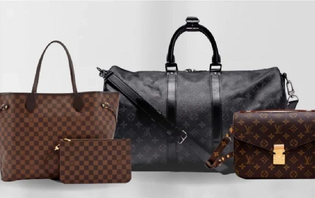 A group of louis vuitton bags and purses.
