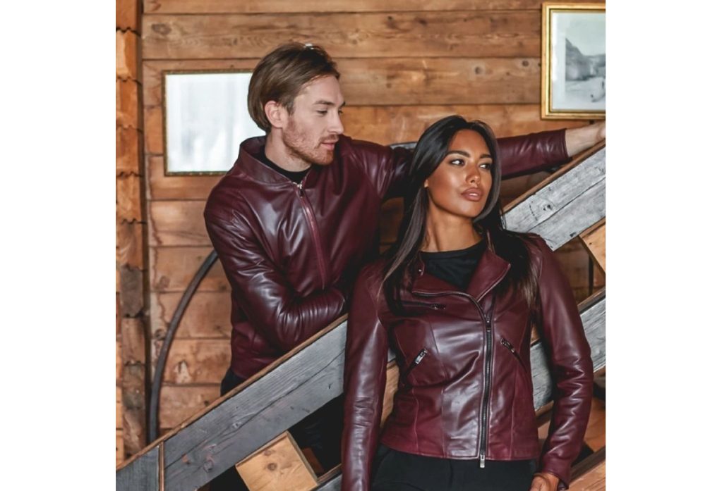 A man and woman in leather jackets standing next to each other.