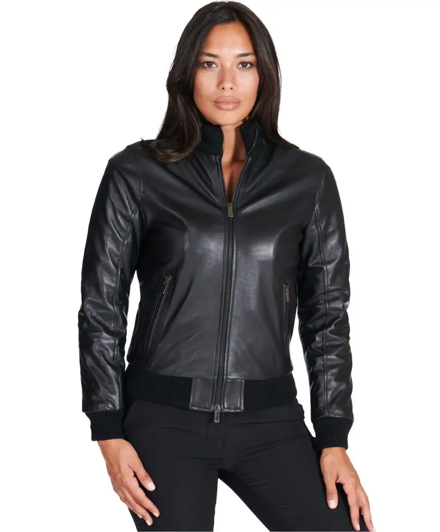 A woman wearing black leather jacket and pants.